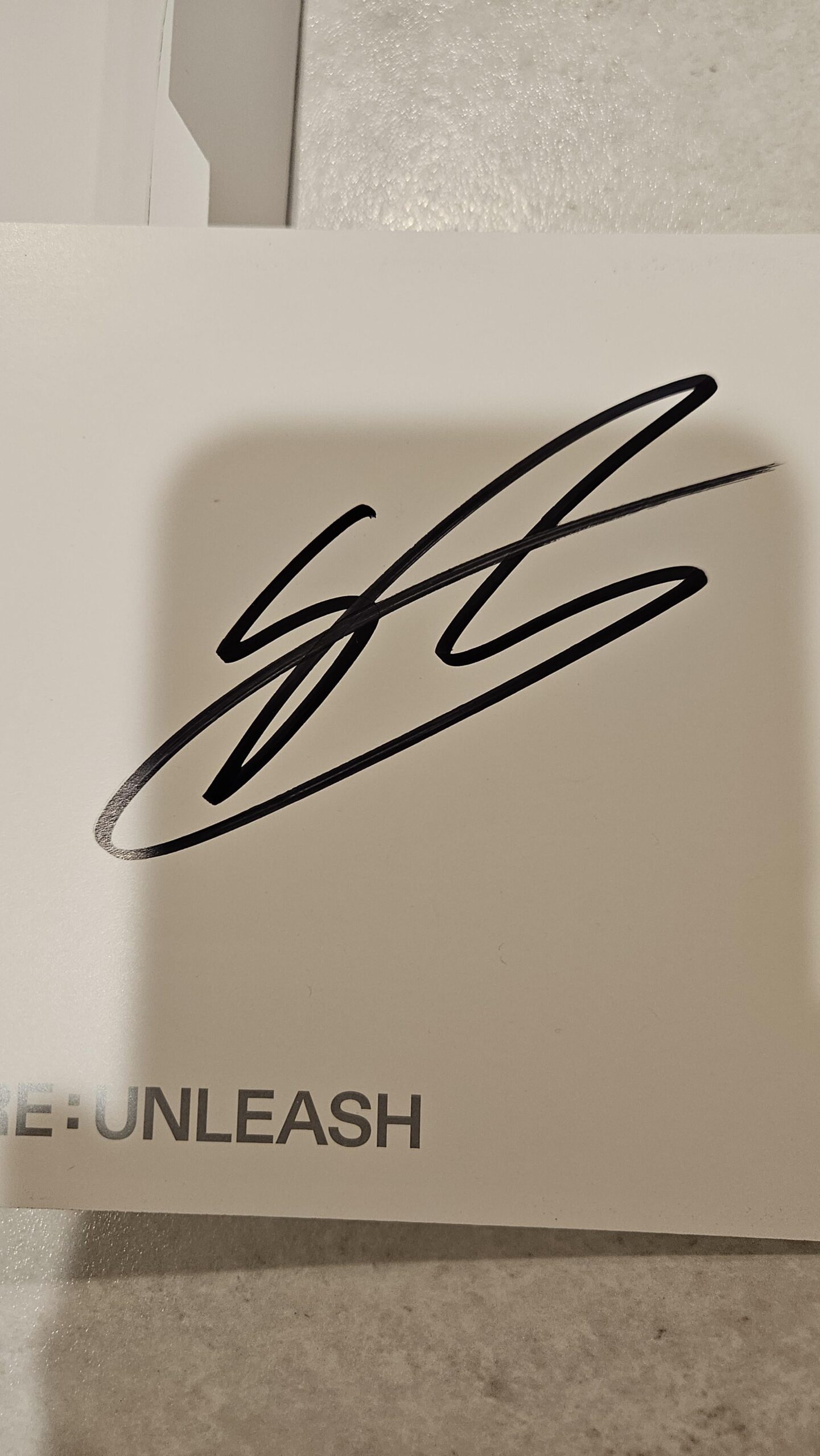 Whose signature is it?