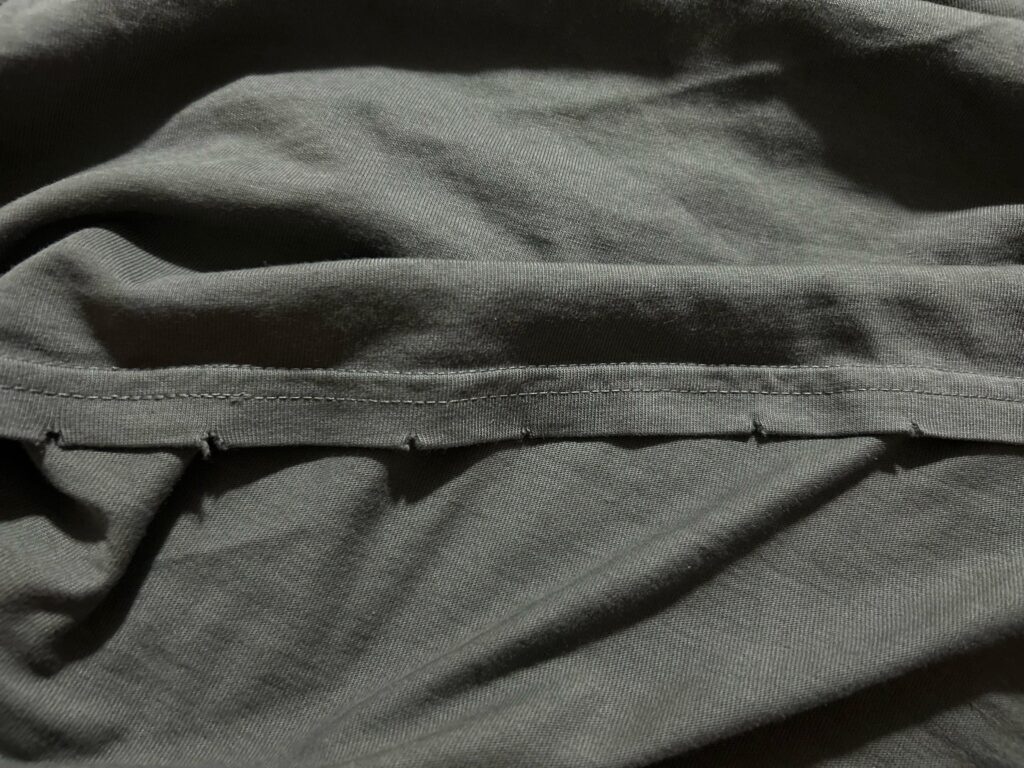 Does anyone else’s tour shirt have this tear pattern around the cutout