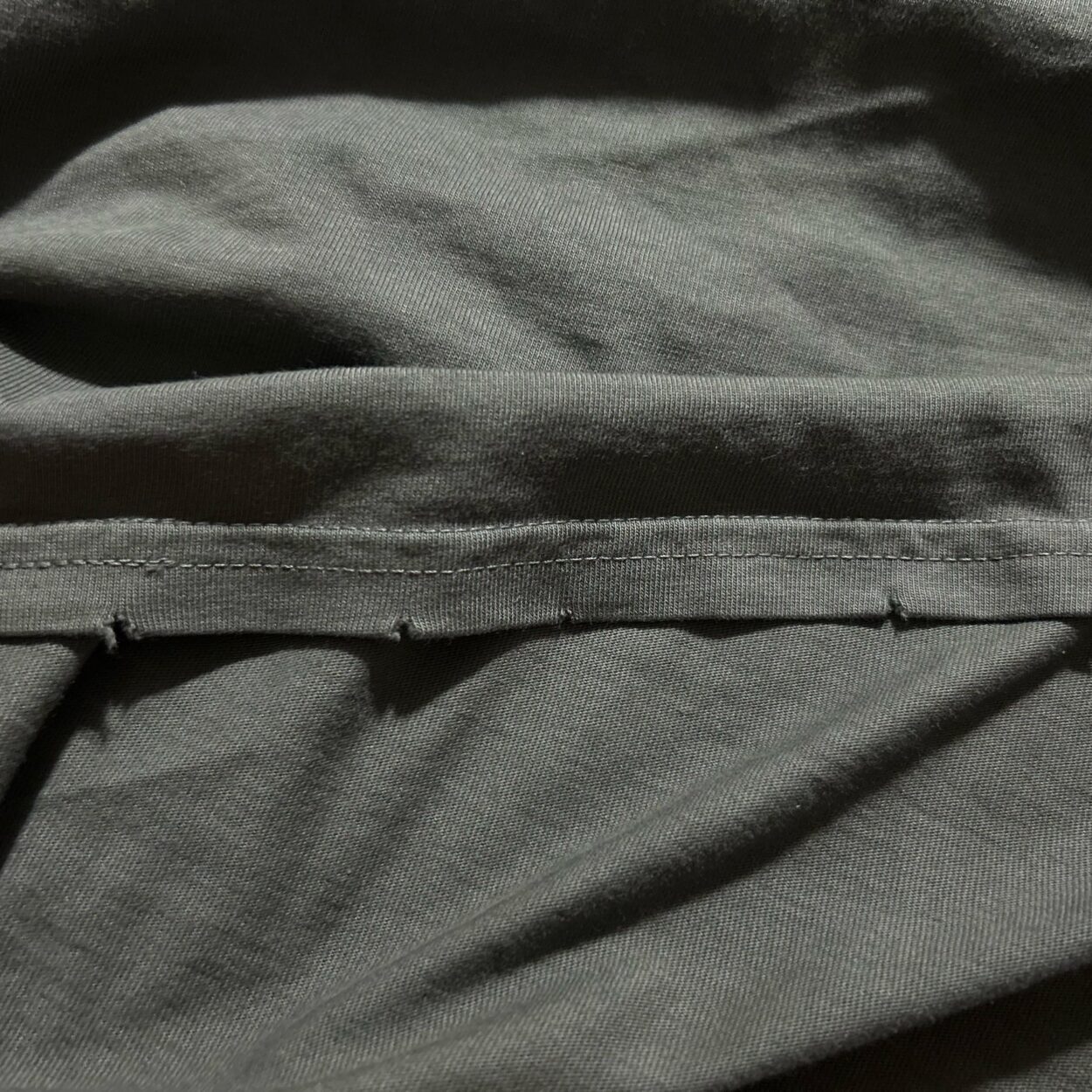 Does anyone else’s tour shirt have this tear pattern around the cutout