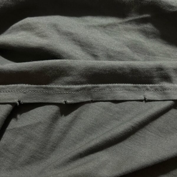 Does anyone else’s tour shirt have this tear pattern around the cutout